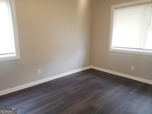 unfurnished room featuring dark hardwood / wood-style floors