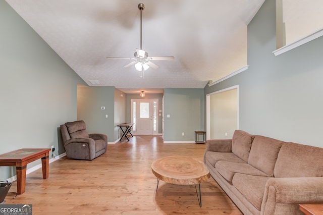 living room featuring ceiling fan and light hardwood / wood-style flooring