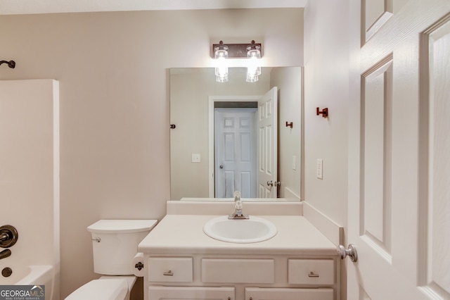 bathroom featuring vanity and toilet