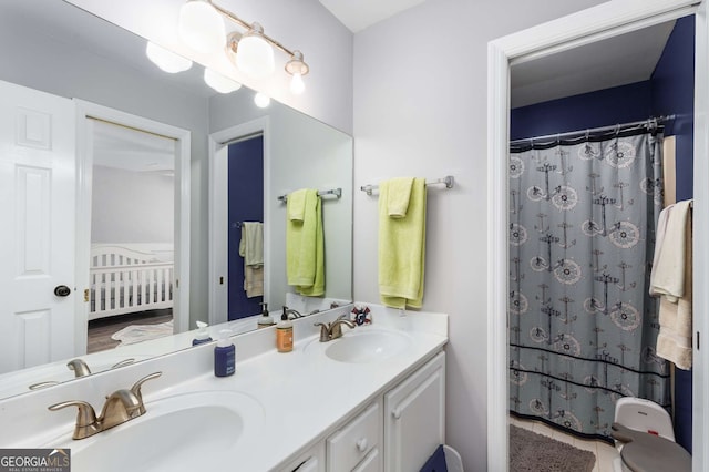 bathroom featuring walk in shower and vanity