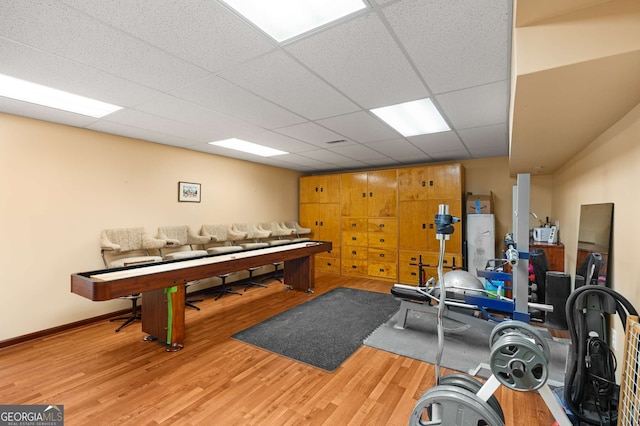 interior space with light hardwood / wood-style flooring and a paneled ceiling