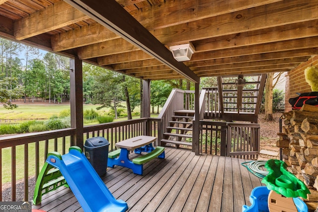 wooden deck with a lawn