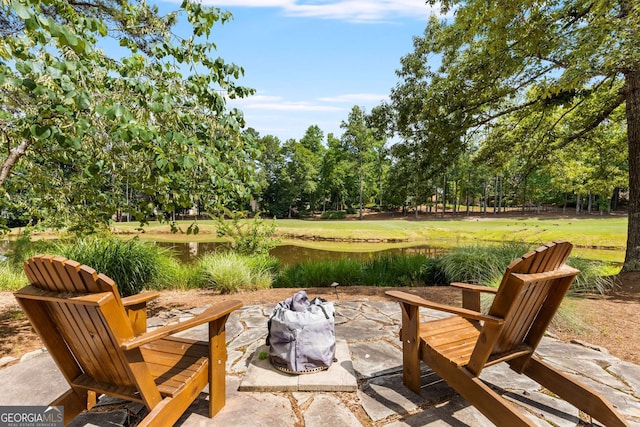 view of patio / terrace with a water view