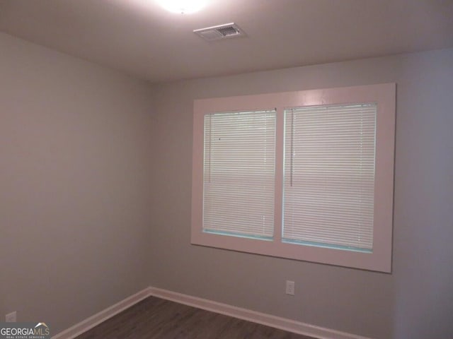 empty room featuring dark hardwood / wood-style floors