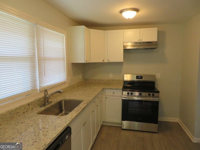 973 Neal St NW, Atlanta, GA 30314 - kitchen featuring a sink, white cabinets, under cabinet range hood, and stainless steel appliances