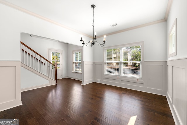 unfurnished dining area featuring a notable chandelier, dark wood-type flooring, and plenty of natural light