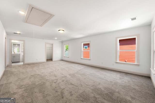 unfurnished room with light carpet