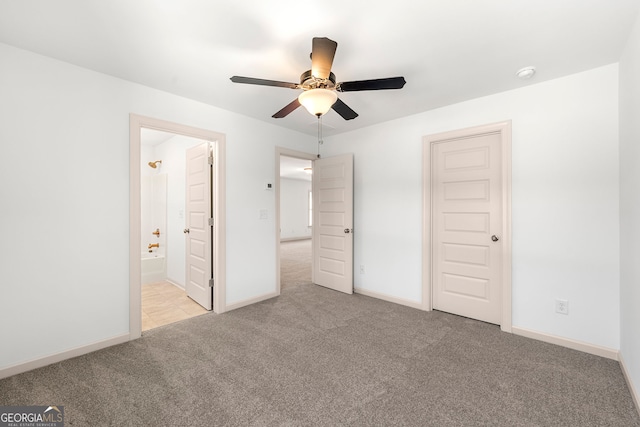 unfurnished bedroom with ceiling fan, light carpet, and ensuite bathroom