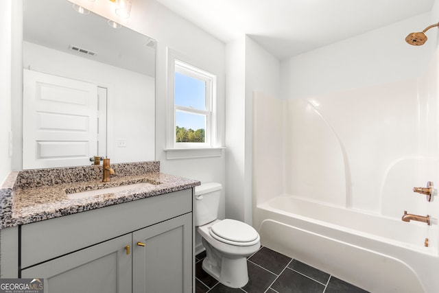 full bathroom with vanity, bathing tub / shower combination, toilet, and tile patterned floors