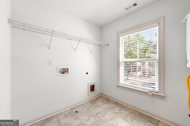 clothes washing area with hookup for an electric dryer and hookup for a washing machine