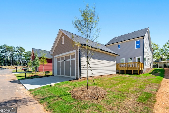 exterior space featuring a lawn and a deck