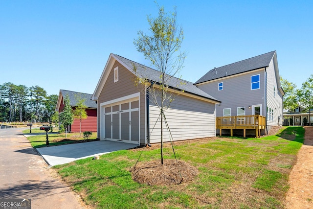 236 Westpark, Athens, GA 30606 - view of side of property with a yard, driveway, a deck, an outbuilding, and an attached garage