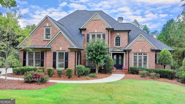 craftsman-style home with a front lawn