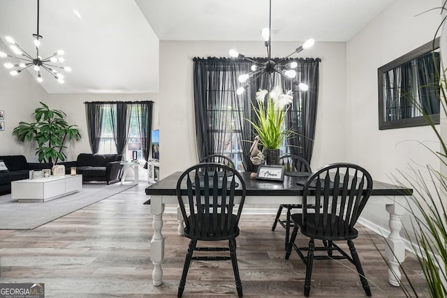 dining room featuring a notable chandelier and hardwood / wood-style flooring