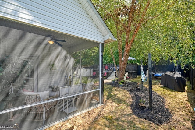 view of yard with ceiling fan