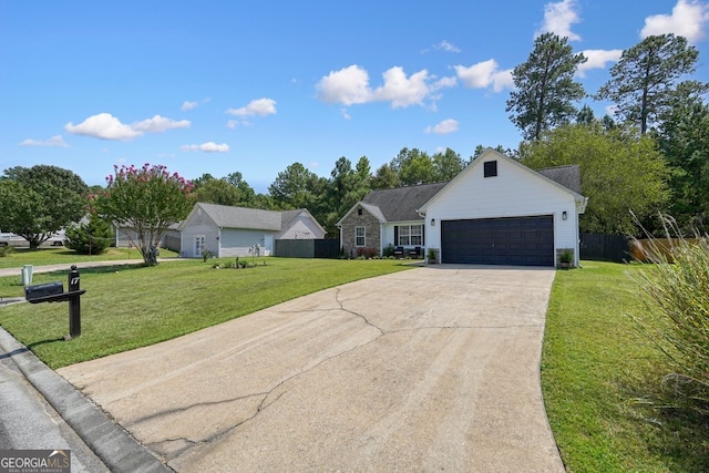 ranch-style home featuring a front yard and a garage