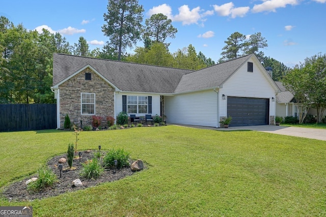 ranch-style house featuring a front yard and a garage