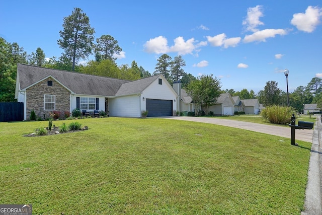 ranch-style home featuring a front lawn and a garage