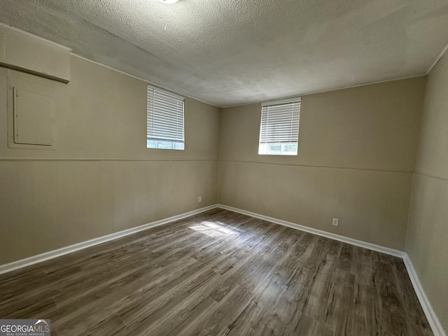 1863 Rollingwood Dr SE, Atlanta, GA 30316 - empty room with wood finished floors, a textured ceiling, and baseboards