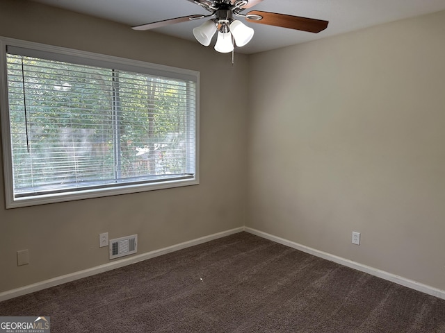 1863 Rollingwood Dr SE, Atlanta, GA 30316 - unfurnished room featuring ceiling fan, dark colored carpet, and baseboards