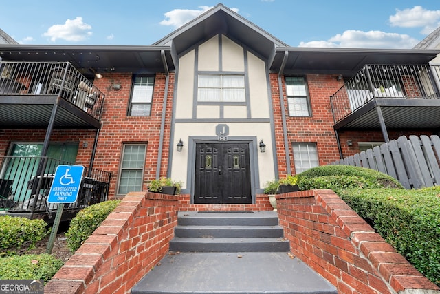 view of front of property with a balcony