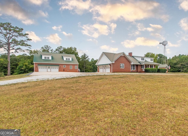 view of front of property with a garage and a front lawn