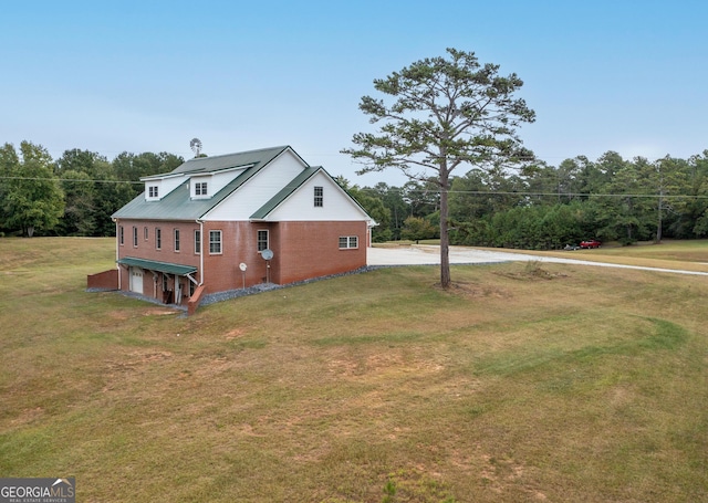 view of property exterior with a yard