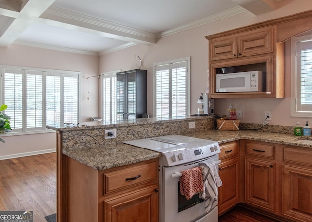 kitchen with light stone counters, dark hardwood / wood-style floors, beam ceiling, coffered ceiling, and white appliances