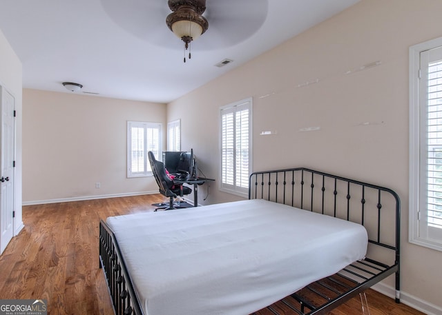 bedroom featuring wood-type flooring and ceiling fan