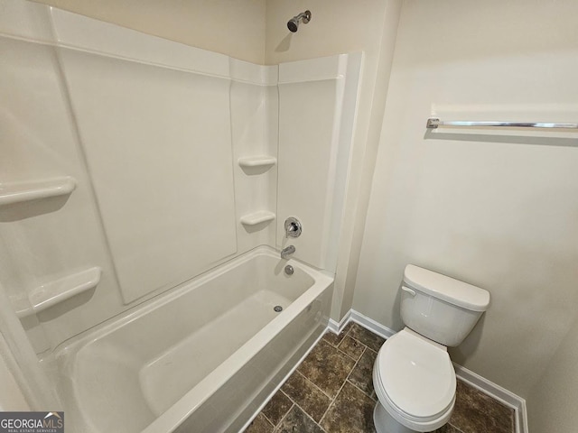 bathroom with toilet and baseboards