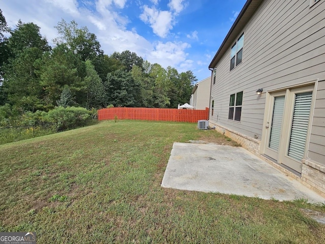 view of yard with a patio, cooling unit, and fence