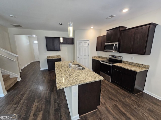 kitchen with a sink, visible vents, appliances with stainless steel finishes, and dark wood-style floors