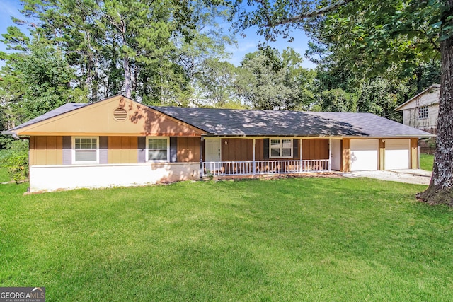 ranch-style home with a front yard, a garage, and a porch