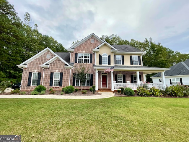 view of front of home featuring a front lawn and a porch