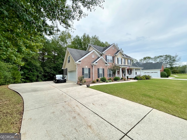 view of front of home with a garage and a front lawn