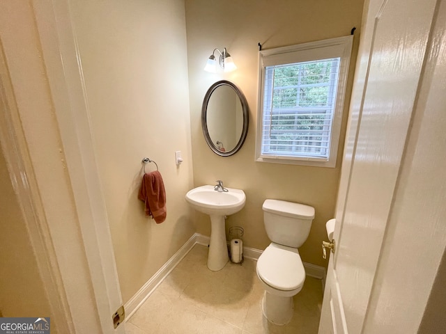 bathroom with sink, tile patterned floors, and toilet