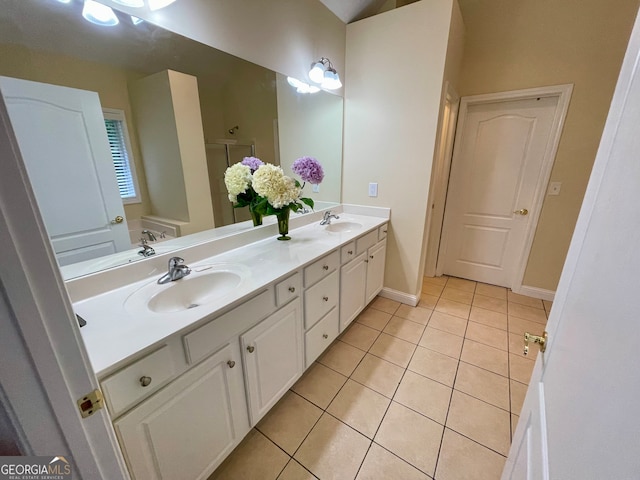 bathroom with tile patterned flooring and vanity