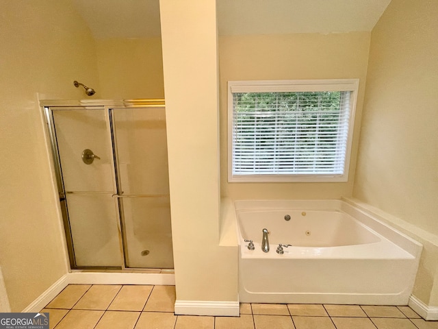 bathroom with separate shower and tub and tile patterned floors