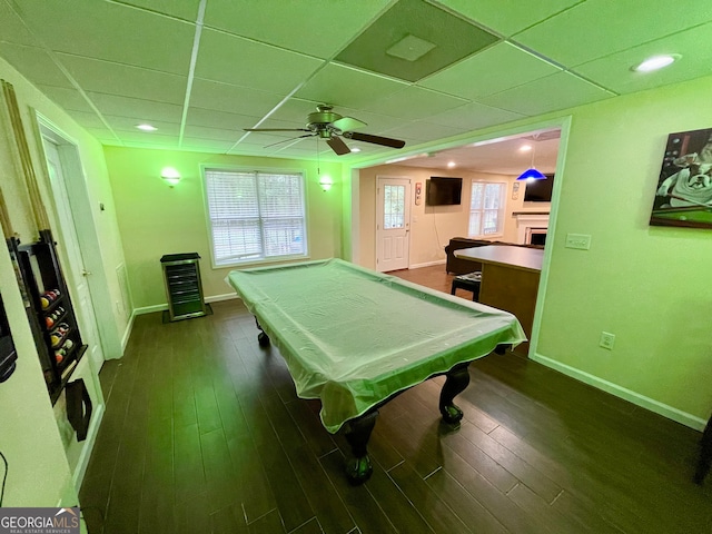 game room with ceiling fan, a drop ceiling, pool table, and dark wood-type flooring