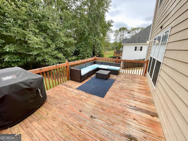 deck with an outdoor living space and grilling area