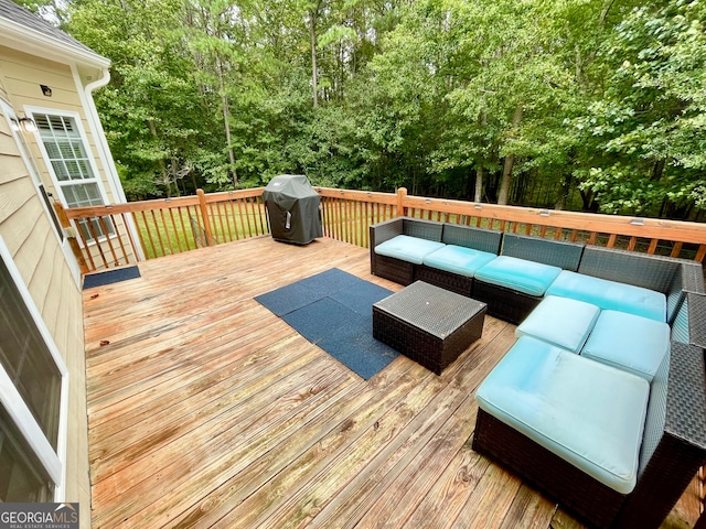 wooden deck featuring an outdoor hangout area and grilling area