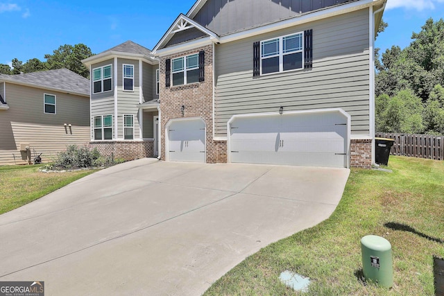 view of front of home featuring a garage and a front yard