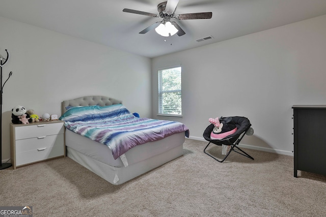 bedroom featuring ceiling fan and light colored carpet