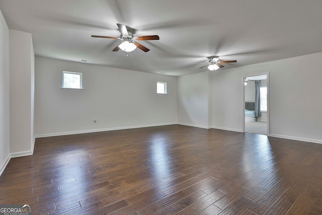 unfurnished room featuring ceiling fan and dark hardwood / wood-style floors