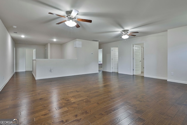 unfurnished living room with ceiling fan and dark hardwood / wood-style flooring