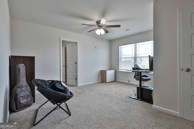 sitting room featuring ceiling fan and carpet flooring