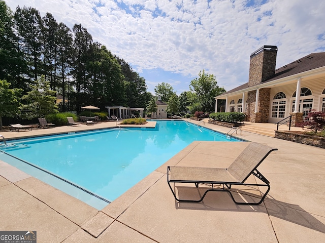 view of pool featuring a patio