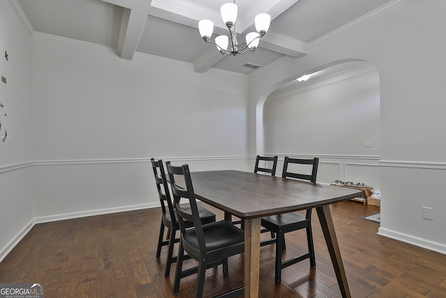 dining area featuring beam ceiling, ornamental molding, and dark wood-type flooring