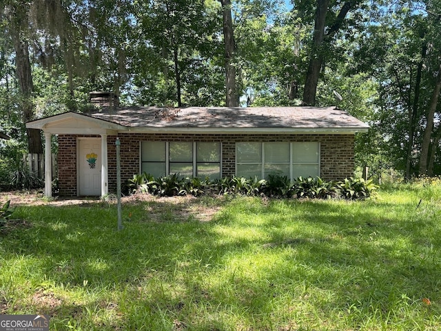 ranch-style house with a front yard