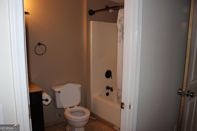 bathroom with tile patterned flooring, shower / bath combination with curtain, and toilet